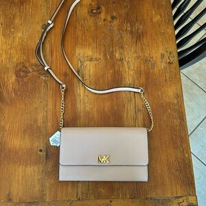 NWT Michael Kors XL Wallet on a chain in soft pink.
